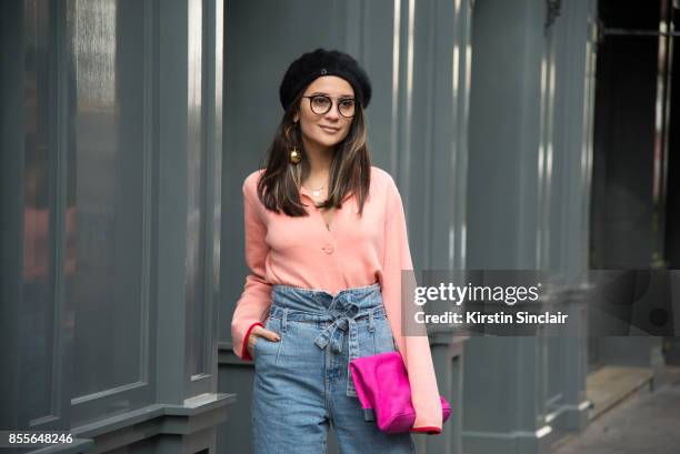 Fashion journalist and co founder of www.and-finally.co.uk Anna Rosa Vitiello wears Current Elliot jeans, Oliver Peoples glasses, Stine Goya jumper,...