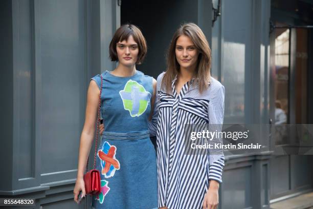 Model Sam Rollinson wears a Henry Holland dress, Chanel bag with Model xcwearing a Henry Holland dress on day 2 of London Womens Fashion Week...