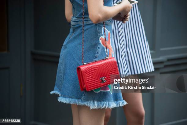 Model Sam Rollinson wears a Henry Holland dress, Chanel bag on day 2 of London Womens Fashion Week Spring/Summer 2018, on September 16, 2017 in...