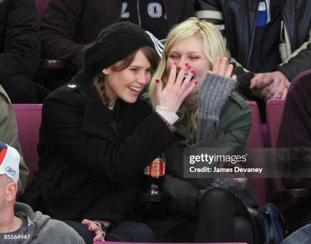 Kirsten Dunst and guest attend the Ottawa Senators versus New York Rangers game at Madison Square Garden on March 22, 2009 in New York City.