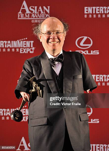 Director Niko von Glasow of Germany poses backstage with the Best Cinematographer award on behalf of Jola Dylewska of Poland for her work in "Tulpan"...