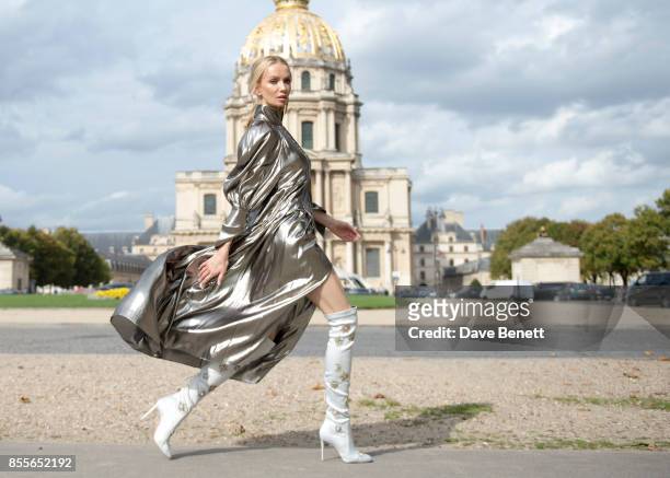 Tatiana Korsakova attends Nina Ricci Spring/Summer 2018 show wearing an Ellery dress,Boots by Aquazzura and Earrings by Loewe during Paris Fashion...