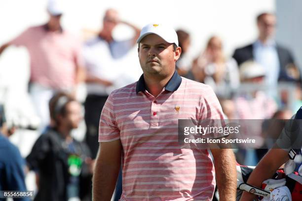 Golfer Patrick Reed walks the first hole during the second round of the Presidents Cup at Liberty National Golf Club on September 29, 2017 in Jersey...
