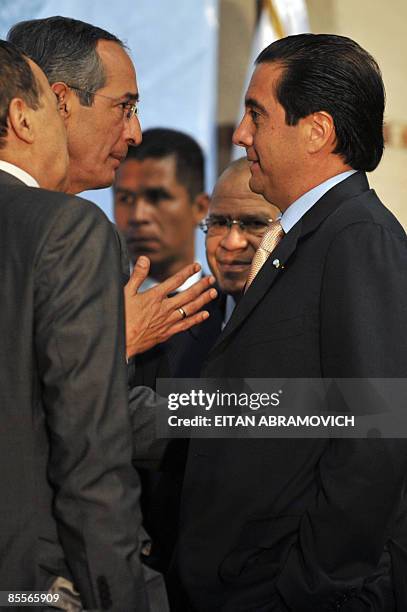 Guatemala's President Alvaro Colom speaks with his Panamanian counterpart Martin Torrijos during the inaguration of the Socialist International...