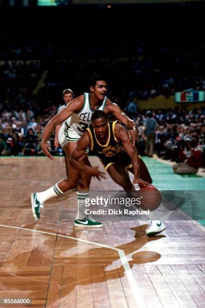 Carl Nicks of the Utah Jazz drives the ball up court against the Boston Celtics during a game played in 1981 at the Boston Garden in Boston,...
