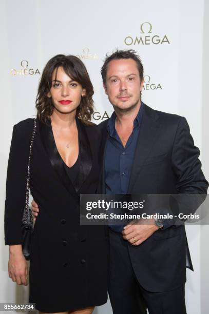 Noemie Elbaz and Davy Sardoux attend the "Her Time" Omega Photocall as part of the Paris Fashion Week Womenswear Spring/Summer 2018 at on September...