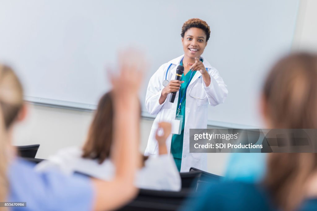 Female doctor teaches a class at medical school