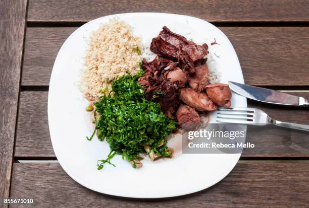 the typical brazilian dish, the feijoada - brazilian feijoada dish stock-fotos und bilder