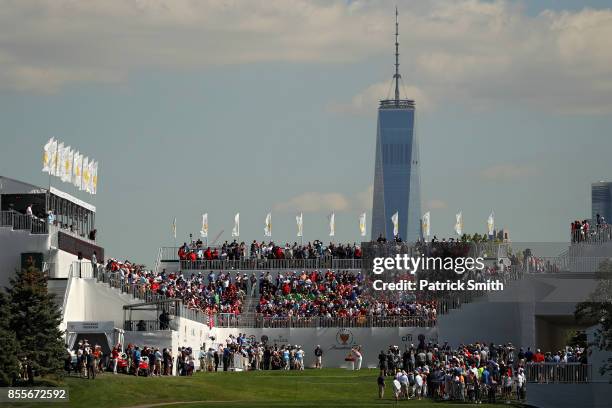 Kevin Kisner of the U.S. Team plays a shot on the first tee during Friday four-ball matches of the Presidents Cup at Liberty National Golf Club on...