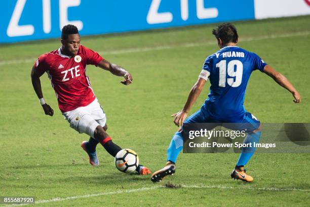 Awal Mahama of Pegasus dribbles SC Kitchee Midfielder Yang Huang during the week three Premier League match between Hong Kong Pegasus and Kitchee at...