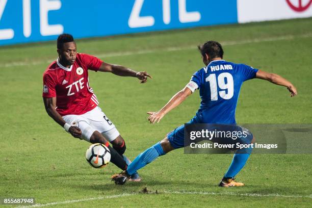 Awal Mahama of Pegasus dribbles SC Kitchee Midfielder Yang Huang during the week three Premier League match between Hong Kong Pegasus and Kitchee at...