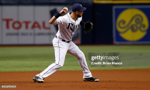 Third baseman Trevor Plouffe of the Tampa Bay Rays fields the ground ball by Manny Machado of the Baltimore Orioles as he starts off the double play...