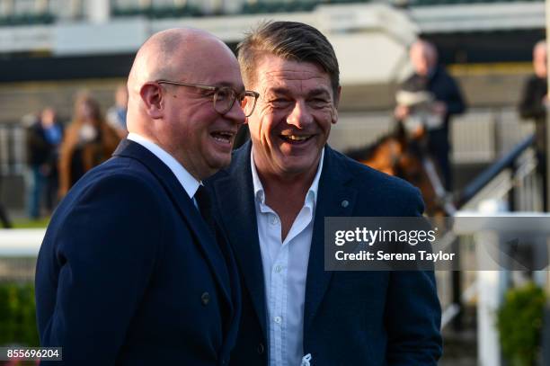 Newcastle Managing Director Lee Charnley and John Carver laugh during the 125 Plate at the Newcastle Race Course on September 29 in Newcastle upon...