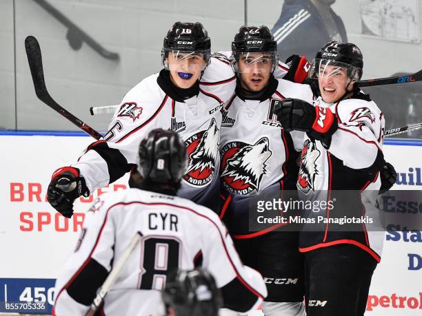 Peter Abbandonato of the Rouyn-Noranda Huskies celebrates his second period goal with teammates against the Blainville-Boisbriand Armada during the...