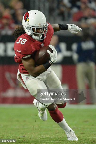 Andre Ellington of the Arizona Cardinals runs with the football in the NFL game against the Dallas Cowboys at University of Phoenix Stadium on...