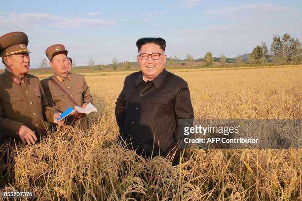 This undated picture released from North Korea's official Korean Central News Agency on September 30, 2017 shows North Korean leader Kim Jong-Un...