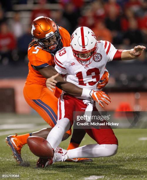 James Crawford of the Illinois Fighting Illini makes the sack on Tanner Lee of the Nebraska Cornhuskers as he fumbles the football at Memorial...