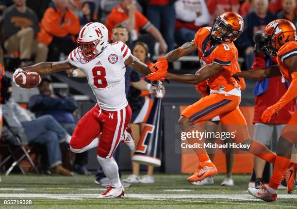 Stanley Morgan Jr. #8 of the Nebraska Cornhuskers runs for the touchdown as Nate Hobbs of the Illinois Fighting Illini attempts the tackle at...