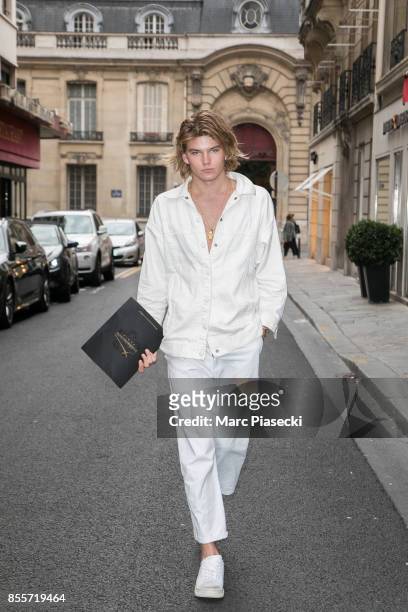 Model Jordan Barrett is seen is seen during Paris Fashion Week dressed down wearing Hogan trainers on September 29, 2017 in Paris, France.