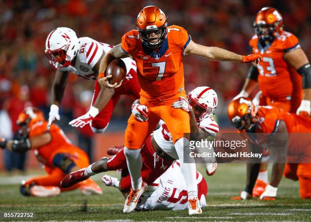 Chayce Crouch of the Illinois Fighting Illini runs the ball as Aaron Williams of the Nebraska Cornhuskers makes the tackle from behind at Memorial...