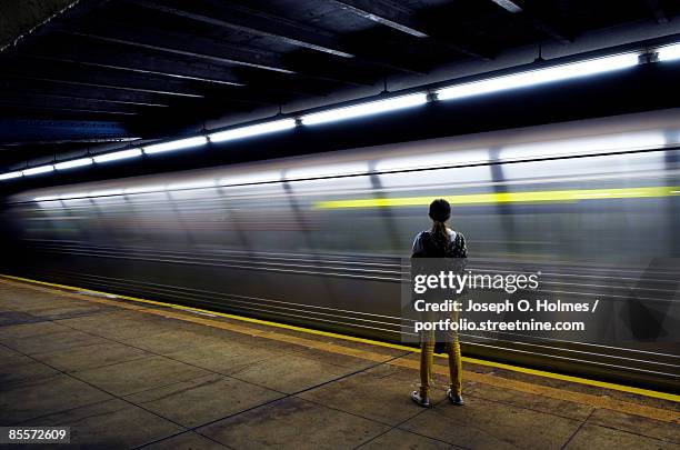 the girl and the night train - u bahnstation stock-fotos und bilder