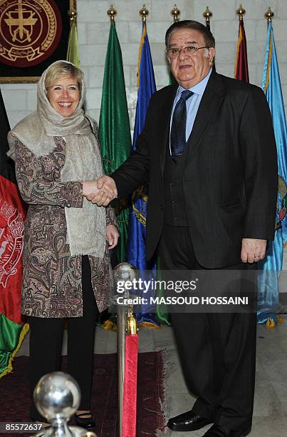 Afghan Minister of Defence Abdul Rahim Wardak shakes hands with Norwegian Minister of Defence Anne-Grete Strom-Erichsen at the Defence Ministry in...