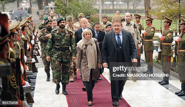 Afghan Minister of Defence Abdul Rahim Wardak and Norwegian Minister of Defence Anne-Grete Strom-Erichsen walk past a guard of honour at the Defence...