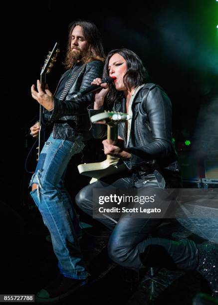 Joe Hottinger and Lzzy Hale of Halestorm performs during Riff Fest at DTE Energy Music Theater on September 29, 2017 in Clarkston, Michigan.