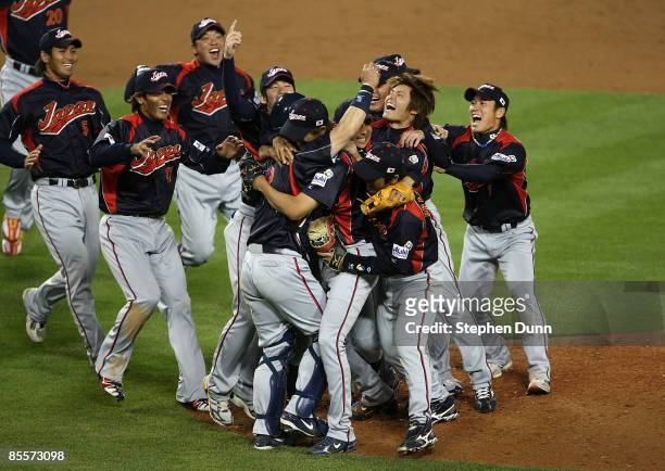 Memebers of team Japan celebrate on the mound after defeating Korea during the finals of the 2009 World Baseball Classic on March 23, 2009 at Dodger...