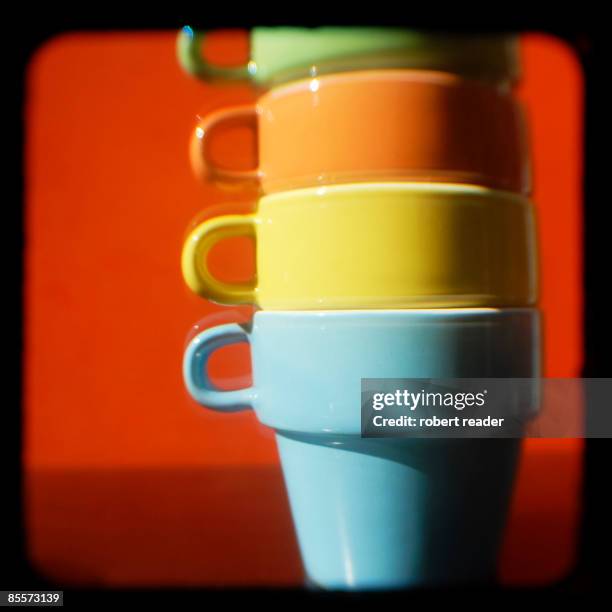 stack of colourful coffee cups - stackable stock pictures, royalty-free photos & images