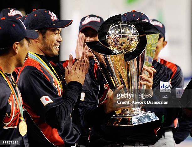 Ichiro Suzuki of Japan looks at the championship trophy after defeating Korea during the finals of the 2009 World Baseball Classic on March 23, 2009...