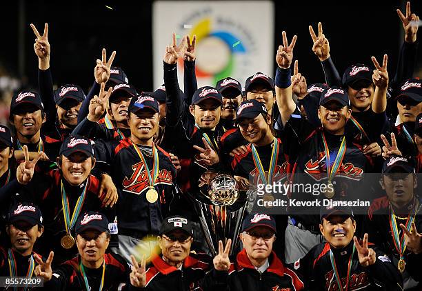 Japan players hold up the championship trophy after defeating Korea during the finals of the 2009 World Baseball Classic on March 23, 2009 at Dodger...