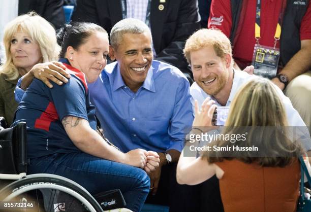 Barack Obama and Prince Harry pose for a photo as thery watch the wheelchair basketball on day 7 of the Invictus Games Toronto 2017 on September 29,...