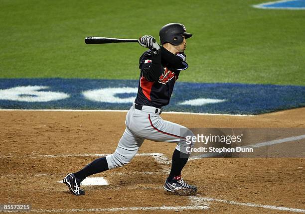 Ichiro Suzuki of Japan hits a leadoff double in the ninth inning against Korea during the finals of the 2009 World Baseball Classic on March 23, 2009...