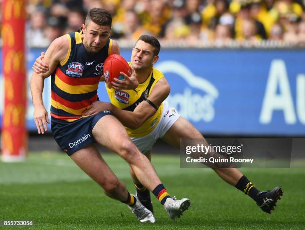 Rory Atkins of the Crows is tackled by Jack Graham of the Tigers during the 2017 AFL Grand Final match between the Adelaide Crows and the Richmond...