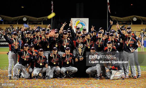 Japan players pose for photos after defeating Korea during the finals of the 2009 World Baseball Classic on March 23, 2009 at Dodger Stadium in Los...