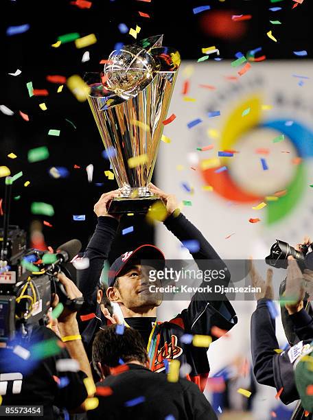 Ichiro Suzuki of Japan holds up the championship trophy after defeating Korea during the finals of the 2009 World Baseball Classic on March 23, 2009...
