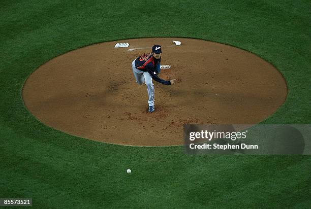 Starting pitcher Hisashi Iwakuma of Japan throws a pitch against Korea during the finals of the 2009 World Baseball Classic on March 23, 2009 at...