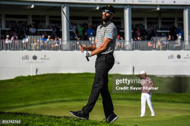 Adam Hadwin of Canada and the International Team reacts after almost holing out on the 15th hole during Friday Four-Ball matches on Day 2 of the...