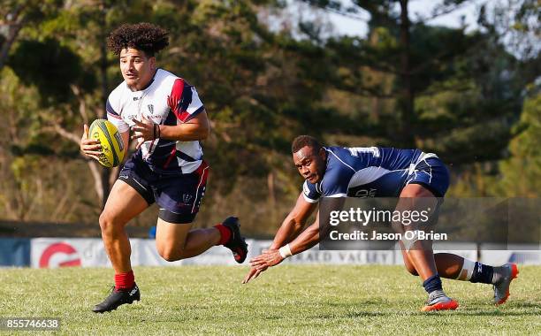 Hunter Paisami of the Rising runs with the ball during the round five NRC match between Queensland Country and Melbourne at Bond University on...