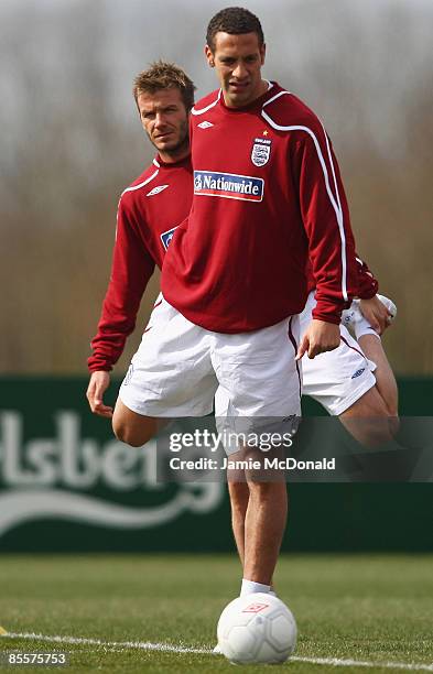 David Beckham and Rio Ferdinand of England warm up during England training at London Colney on March 24, 2009 in St Albans, England.