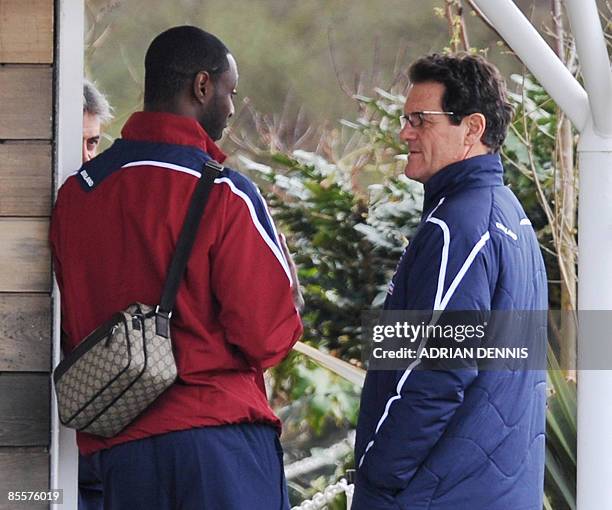 England Manager Fabio Capello talks with defender Ledley King ahead of the England training session at Arsenal's training facility in London Colney...
