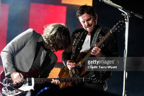 Matthew Followill and Caleb Followill of 'Kings Of Leon' perform at First Tennessee Park on September 29, 2017 in Nashville, Tennessee.