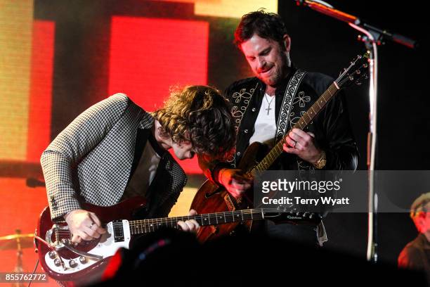 Matthew Followill and Caleb Followill of 'Kings Of Leon' perform at First Tennessee Park on September 29, 2017 in Nashville, Tennessee.