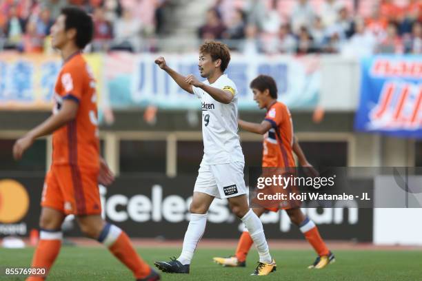 Kazuma Watanabe of Vissel Kobe celebrates his side's first goal scored by Yuto Horigome of Albirex Niigata during the J.League J1 match between...