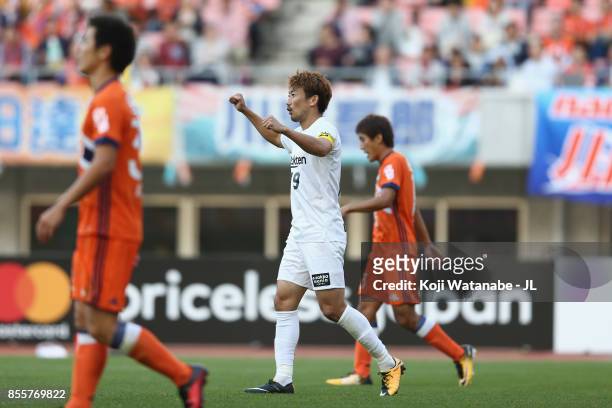 Kazuma Watanabe of Vissel Kobe celebrates his side's first goal scored by Yuto Horigome of Albirex Niigata during the J.League J1 match between...