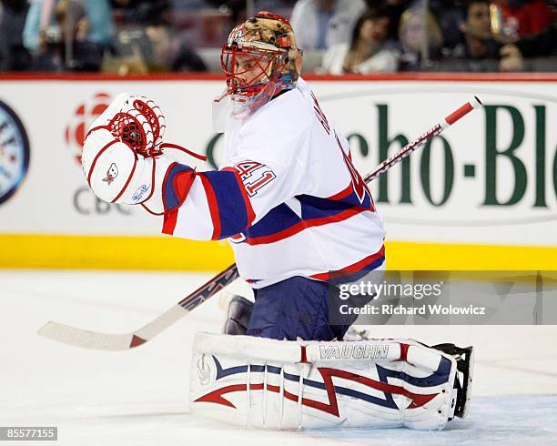 Jaroslav Halak of the Montreal Canadiens makes a glove save during the warm up period prior to facing the New Jersey Devils at the Bell Centre on...