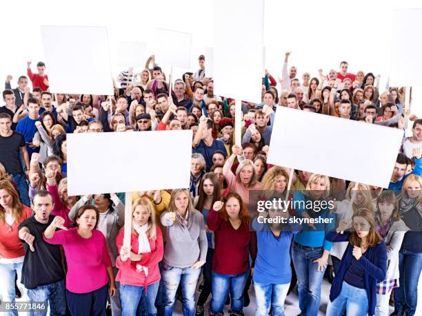 crowd of people holding white banners and demonstrating. - protestor crowd stock pictures, royalty-free photos & images