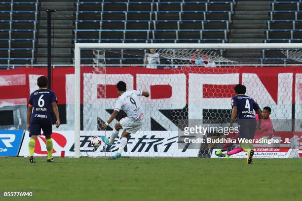 Ken Tokura of Consadole Sapporo converts the penalty to score his side's first goal during the J.League J1 match between Sanfrecce Hiroshima and...