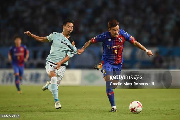 Jang Hyun Soo of FC Tokyo and Hayao Kawabe of Jubilo Iwata compete for the ball during the J.League J1 match between FC Tokyo and Jubilo Iwata at...